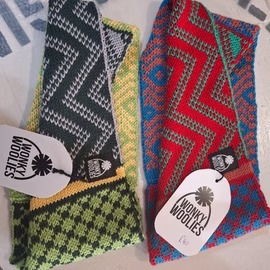 Colorful knitted scarves displayed