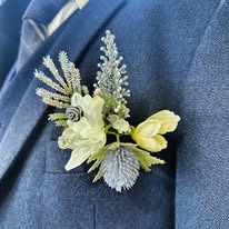 Floral boutonnière on suit jacket